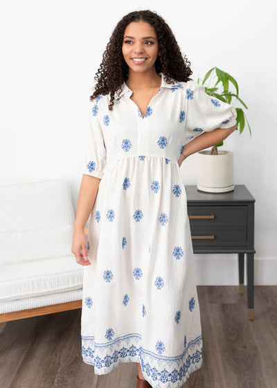 Cream embroidered dress with pattern hem