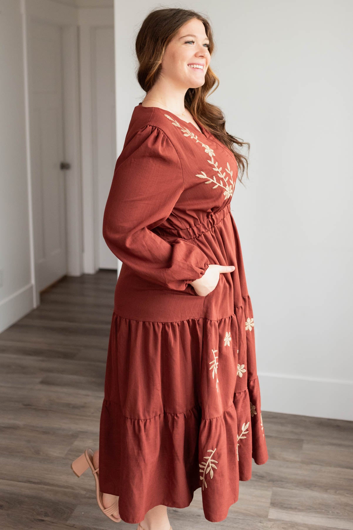 Side view of the plus size burgundy embroidered floral dress with pockets