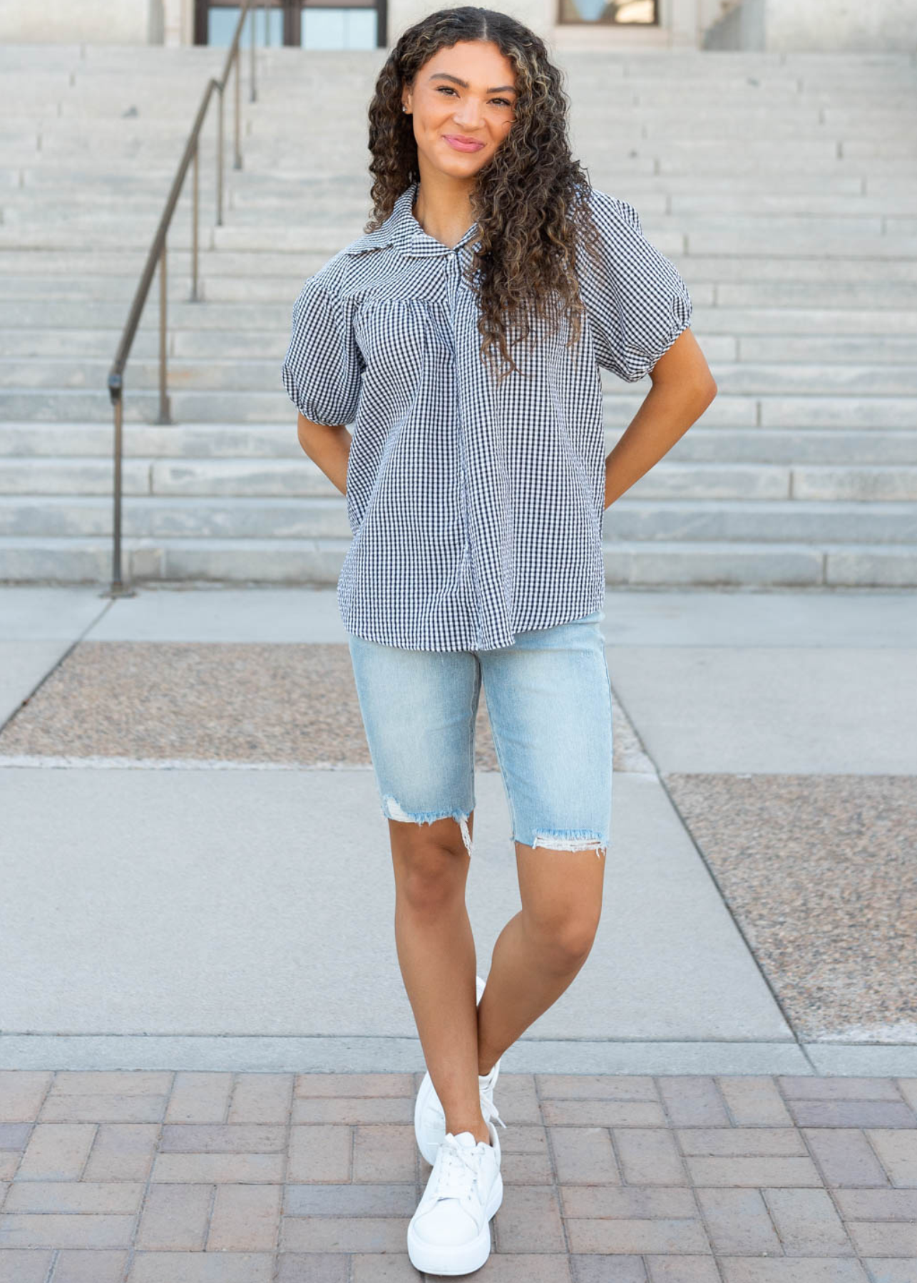 Front view of the black plaid collared top