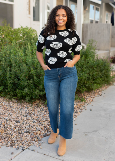 Black floral print sweater with white flowers