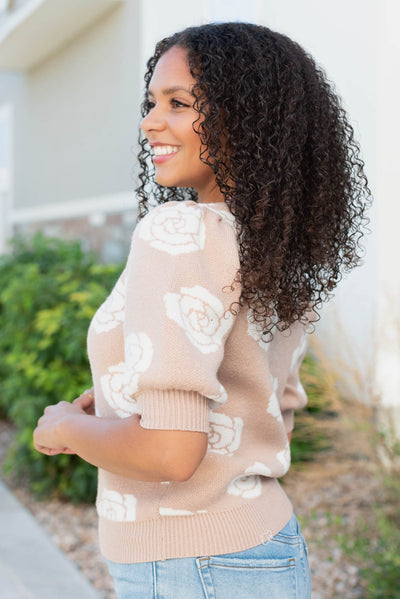 Side view of the taupe floral print sweater