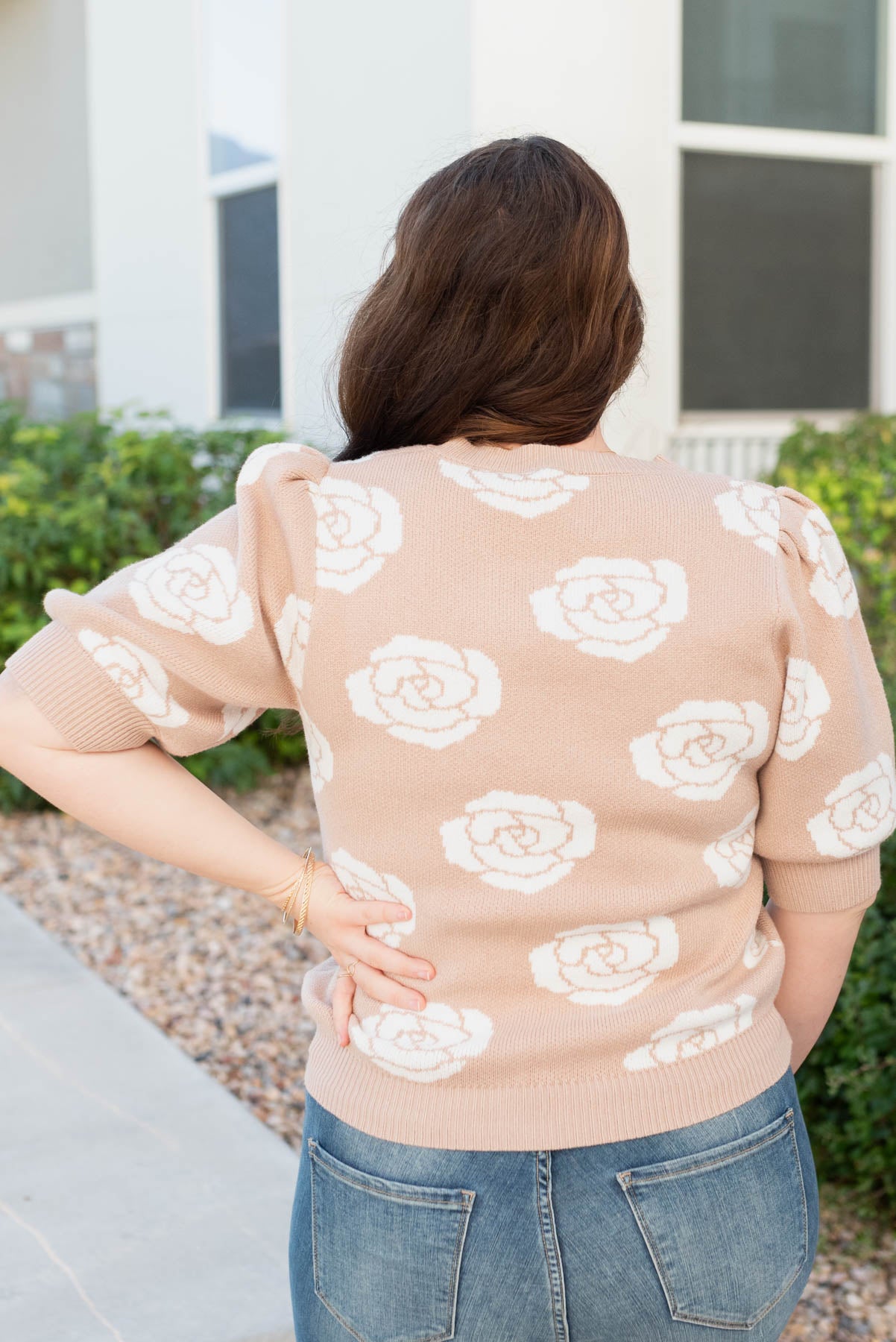 Back view of the plus size taupe floral print sweater