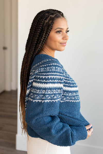 Side view of the navy knit sweater