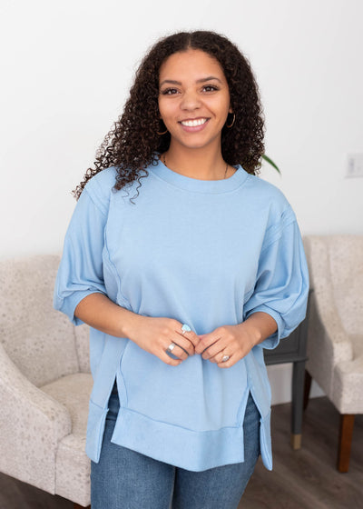 Three quater sleeves on the blue textured pullover