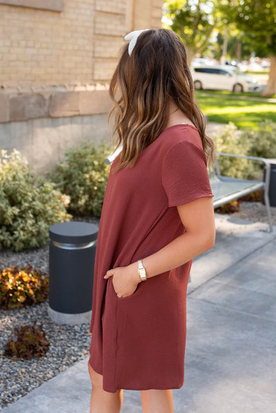 Side view of the brick red relaxed dress