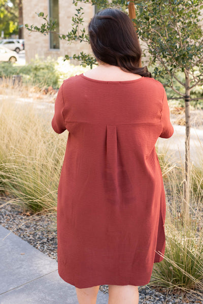 Back view of the plus size brick red relaxed dress