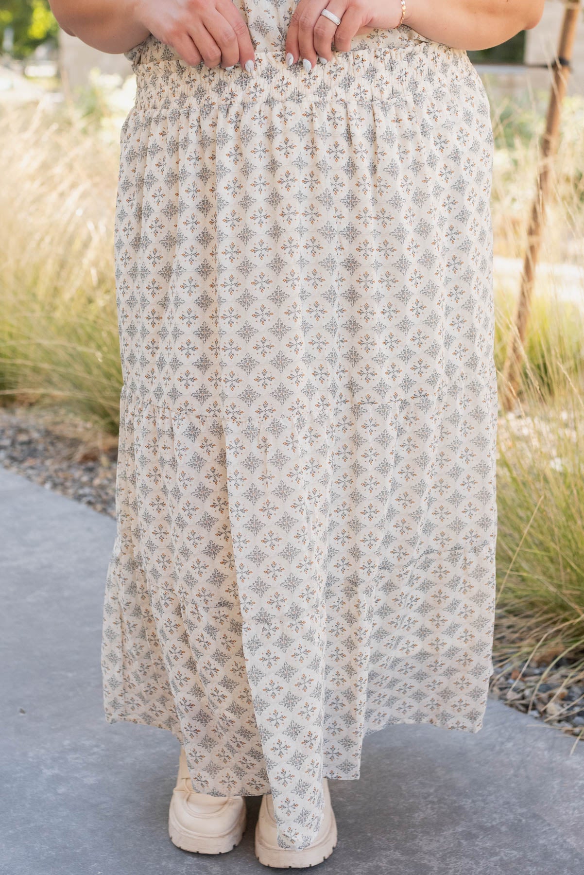 Front view of the plus size cream pattern chiffon skirt