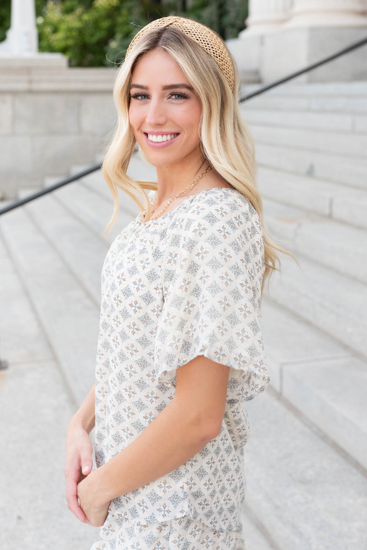 Side view of the cream pattern chiffon top