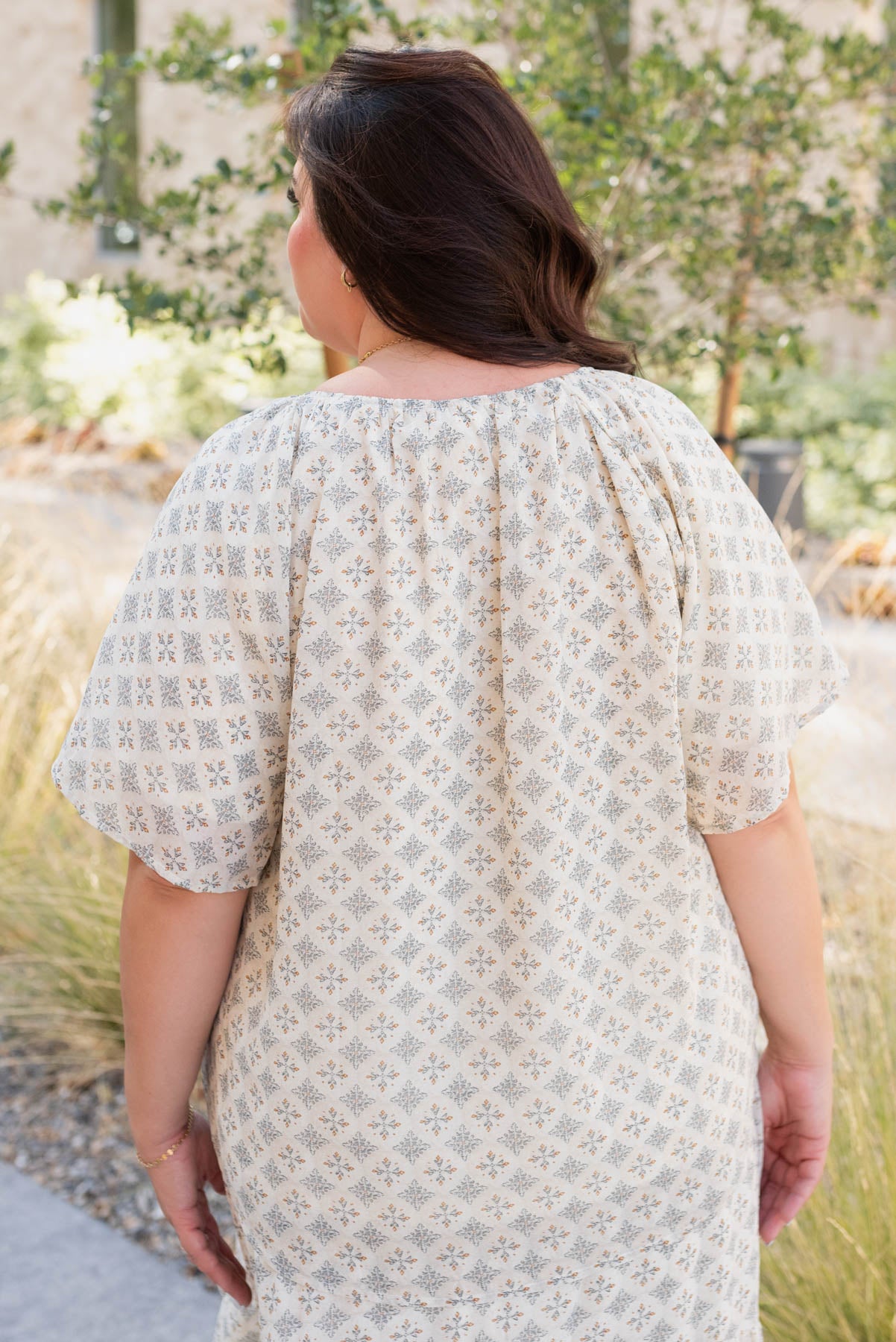 Back view of the plus size cream pattern chiffon top