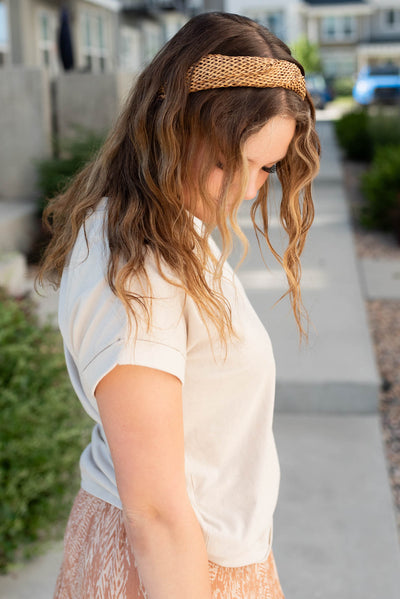 Side view of the sand beige folded sleeve top