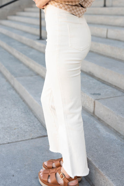 Side view of the cream high rise pants