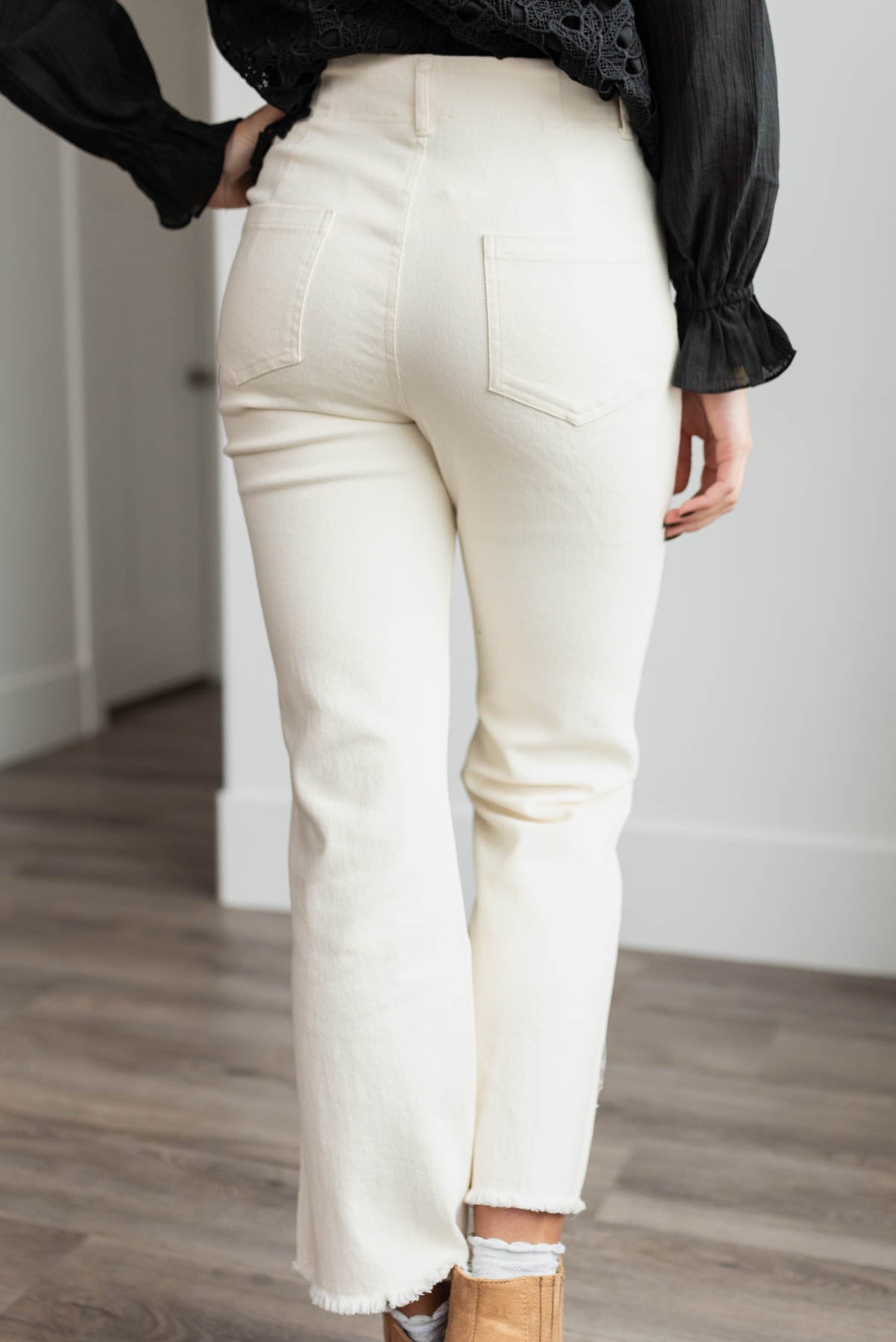 Back view of the cream high rise pants