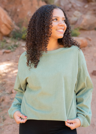 Front view of the green ribbed sweatershirt