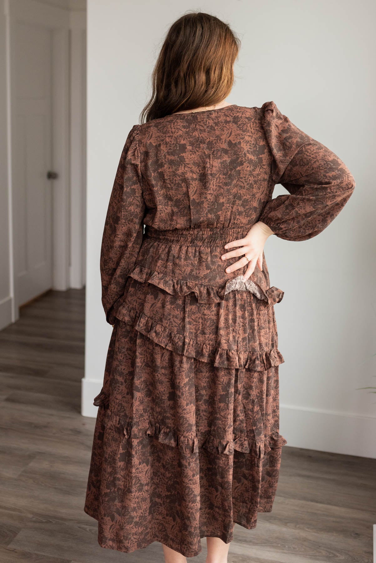 Back view of the plus size mahogany floral tiered dress