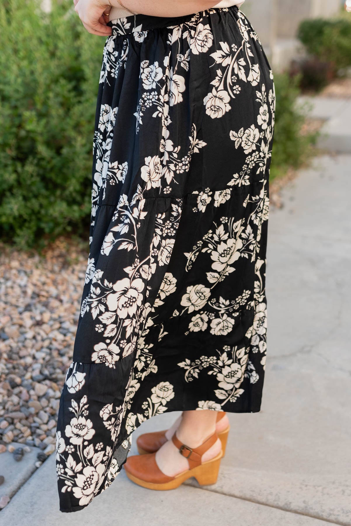 Side view of the black floral skirt in plus size