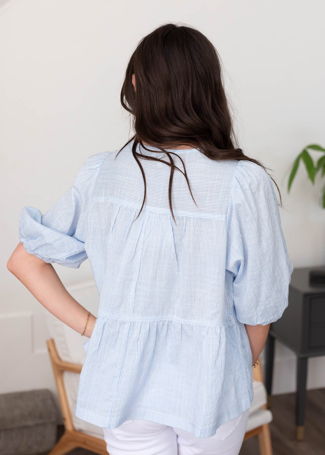 Back view of the light blue striped top