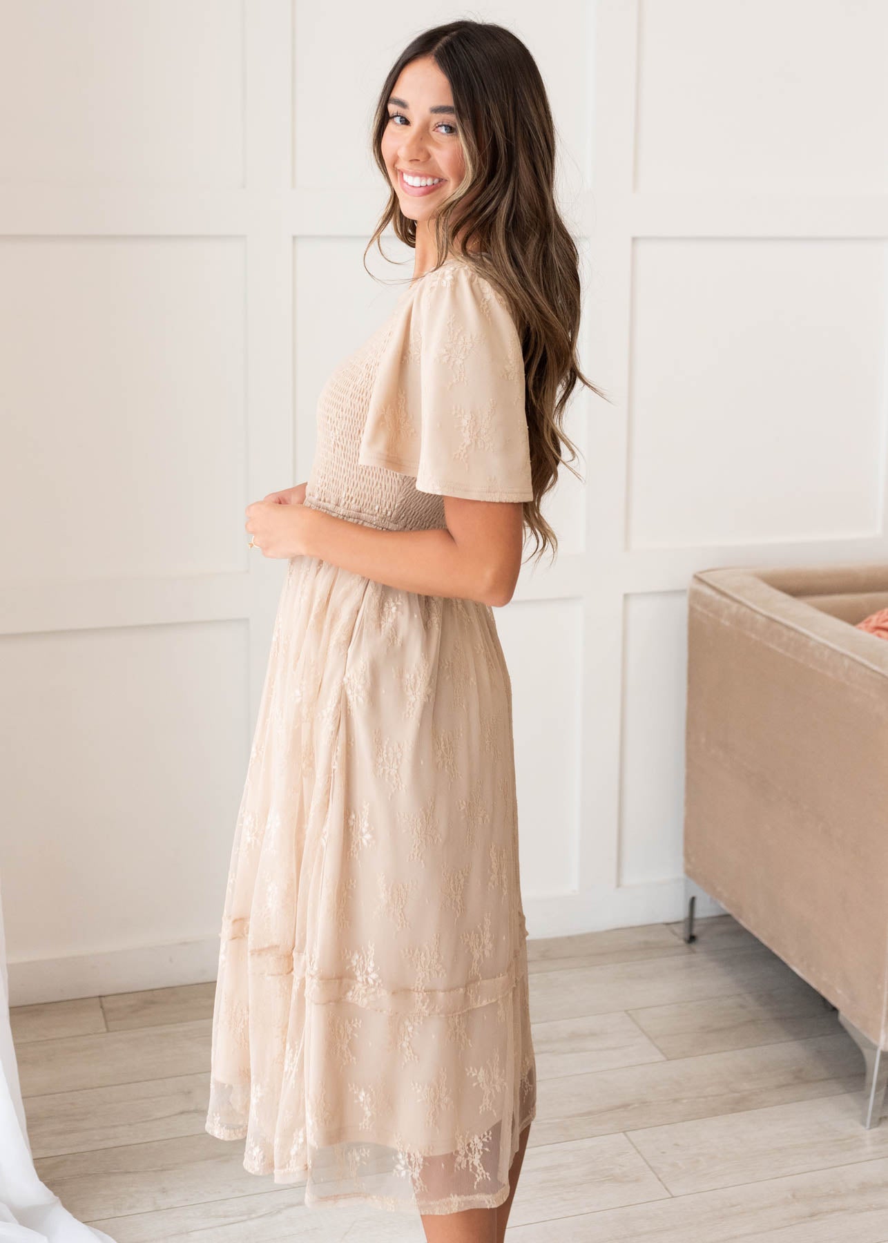 Side view of the beige smocked lace dress