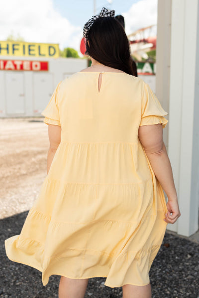 Back view of the light yellow tiered dress
