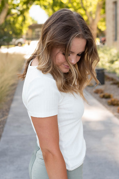 Side view of the ivory ribbed top