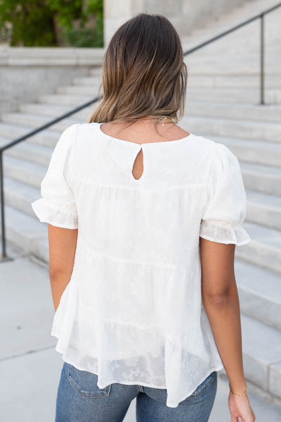 Back view white floral ruffle top