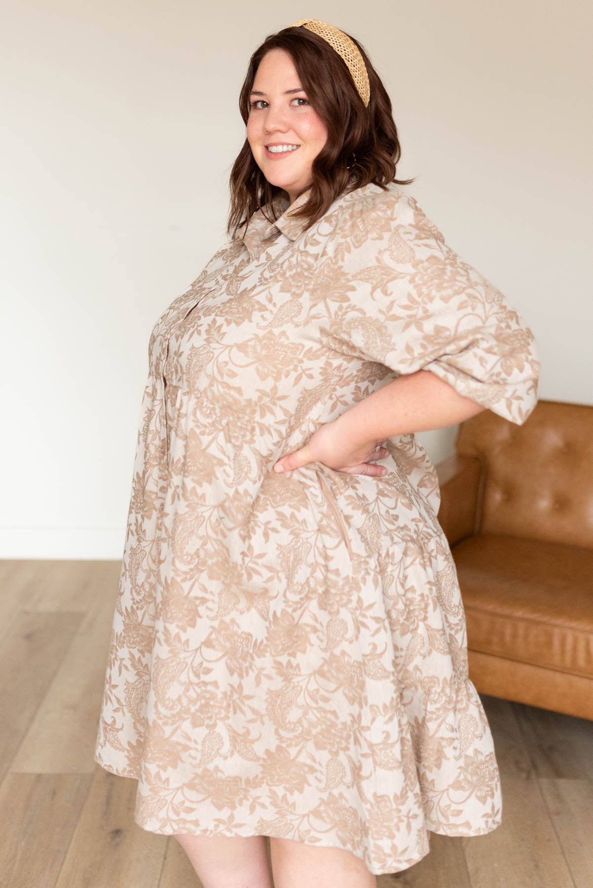 Side view of the plus size taupe floral button down dress