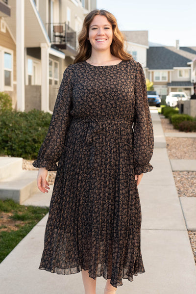 Front view of the plus size navy multi floral dress with long sleeves