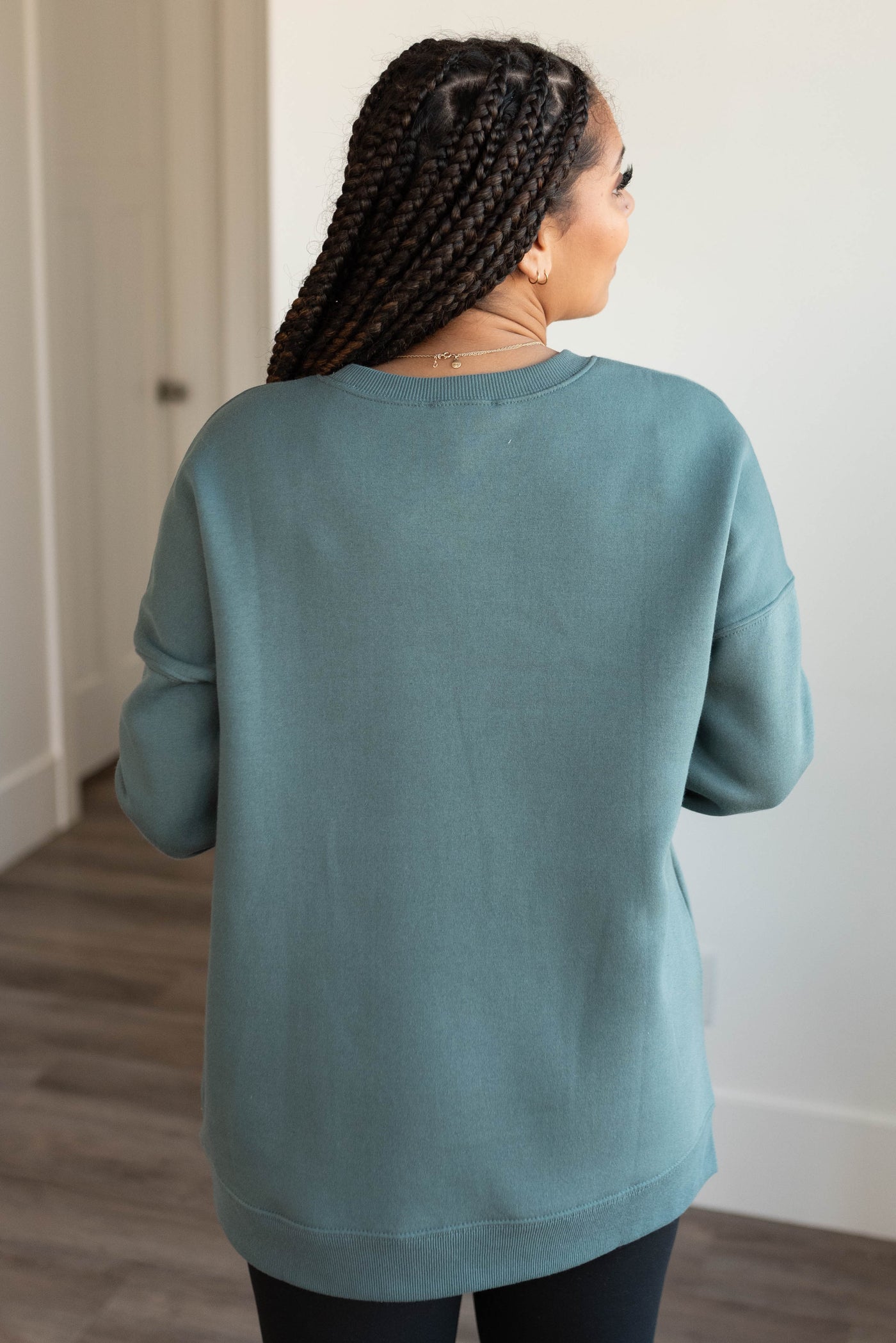 Back view of the jade pocketed sweater