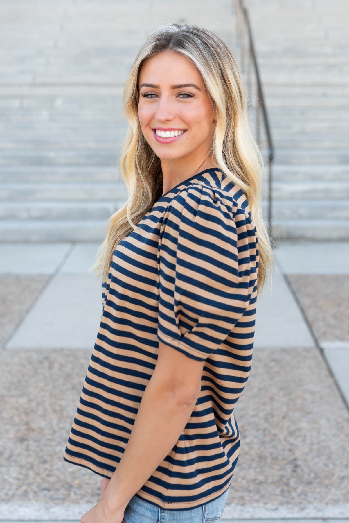 Side view of the navy camel stripe top