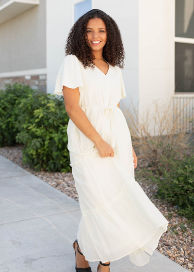 Front view of the cream button down dress