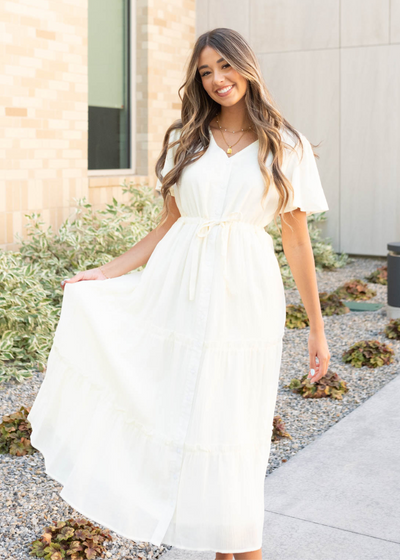 Cream button down dress with a tie at the waist