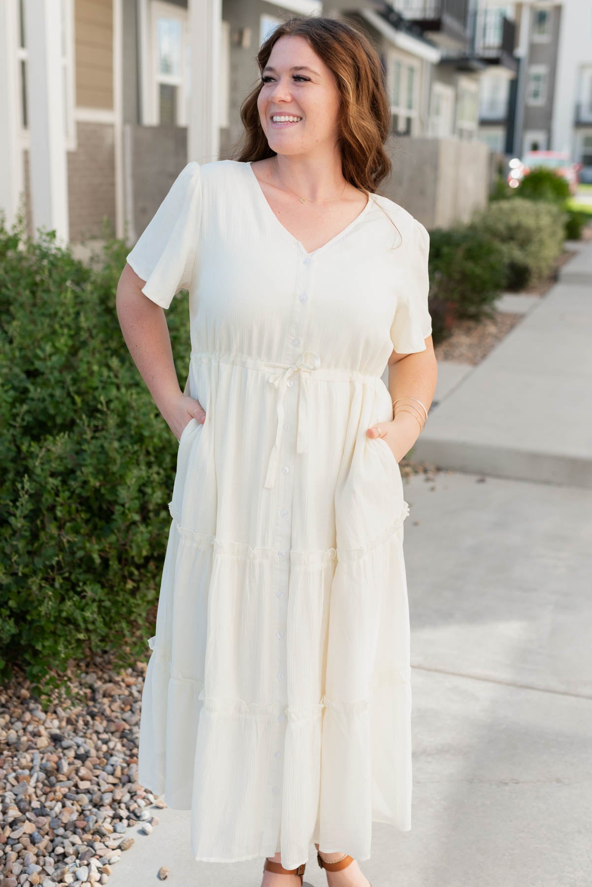 Plus size cream button down dress with a v-neck