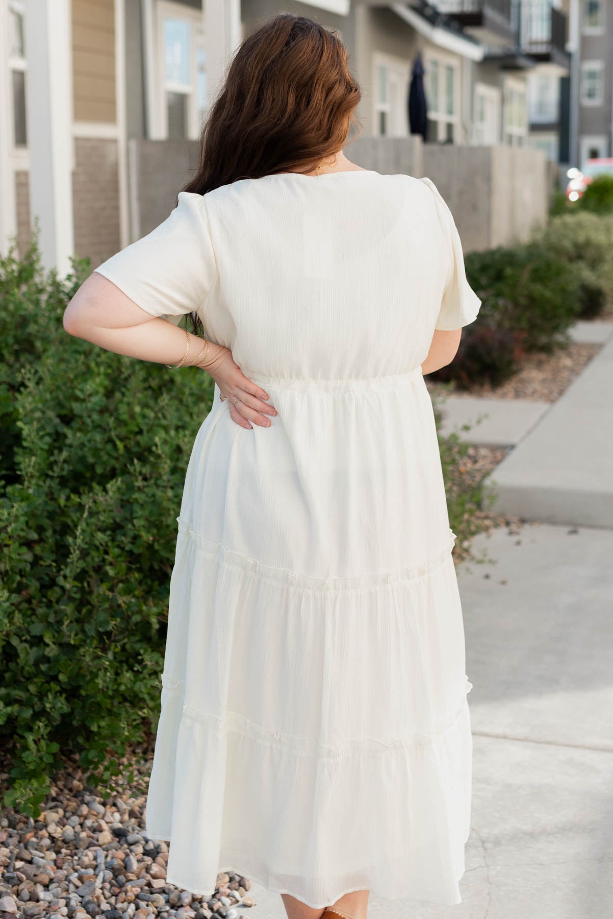 Back view of the plus size cream button down dress