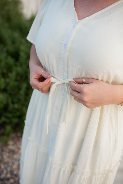 Plus size cream button down dress with tie at the waist