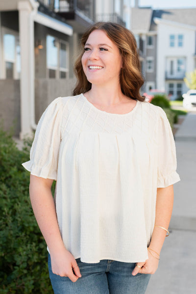 Front view of the plus size ivory blouse