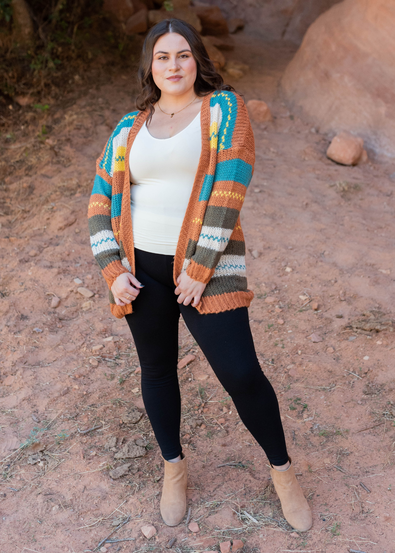 Front view of the plus size color block rust cardigan