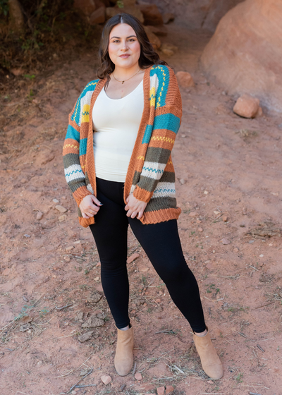 Front view of the plus size color block rust cardigan