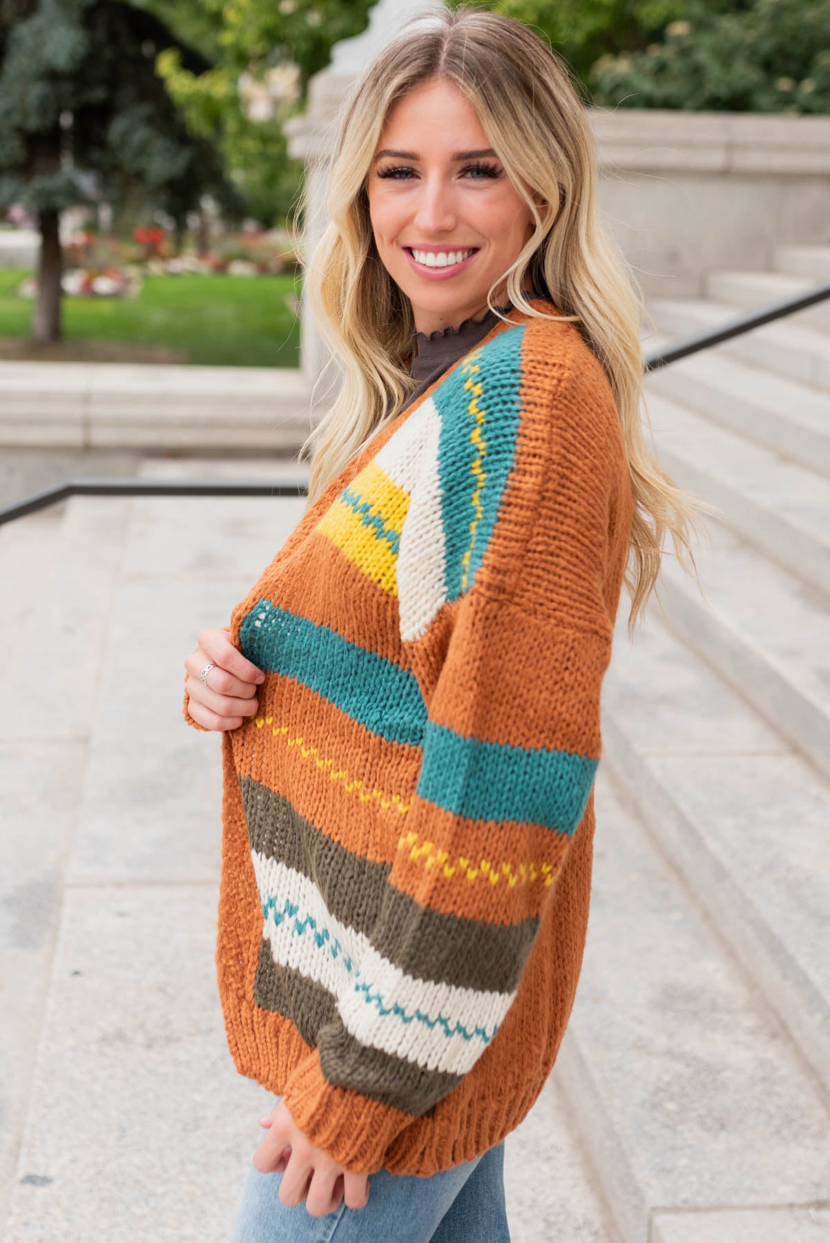 Side view of the color block rust cardigan