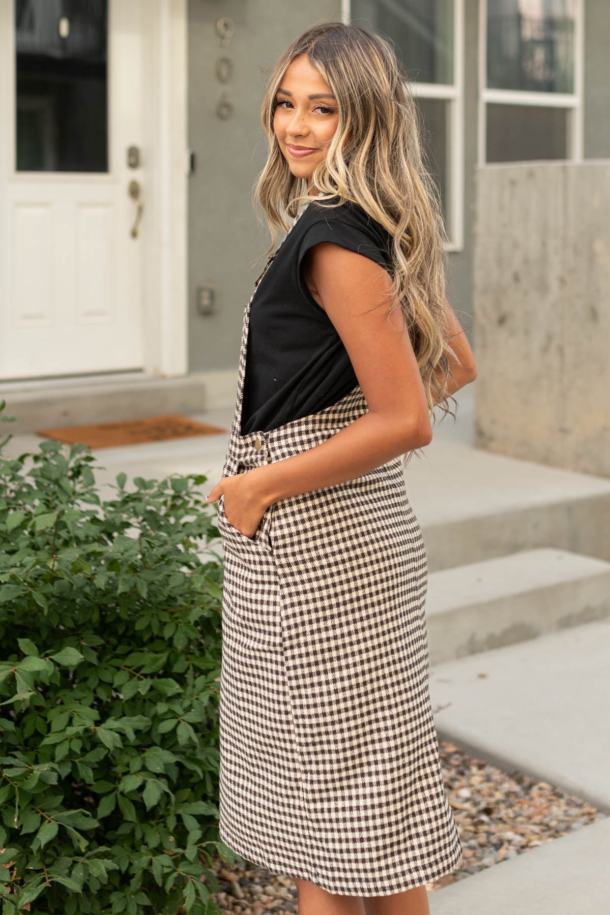 Side view of a mocha plaid dress