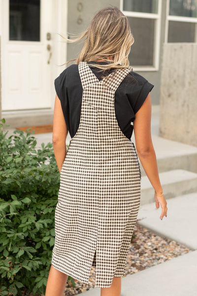 Back view of a mocha plaid dress