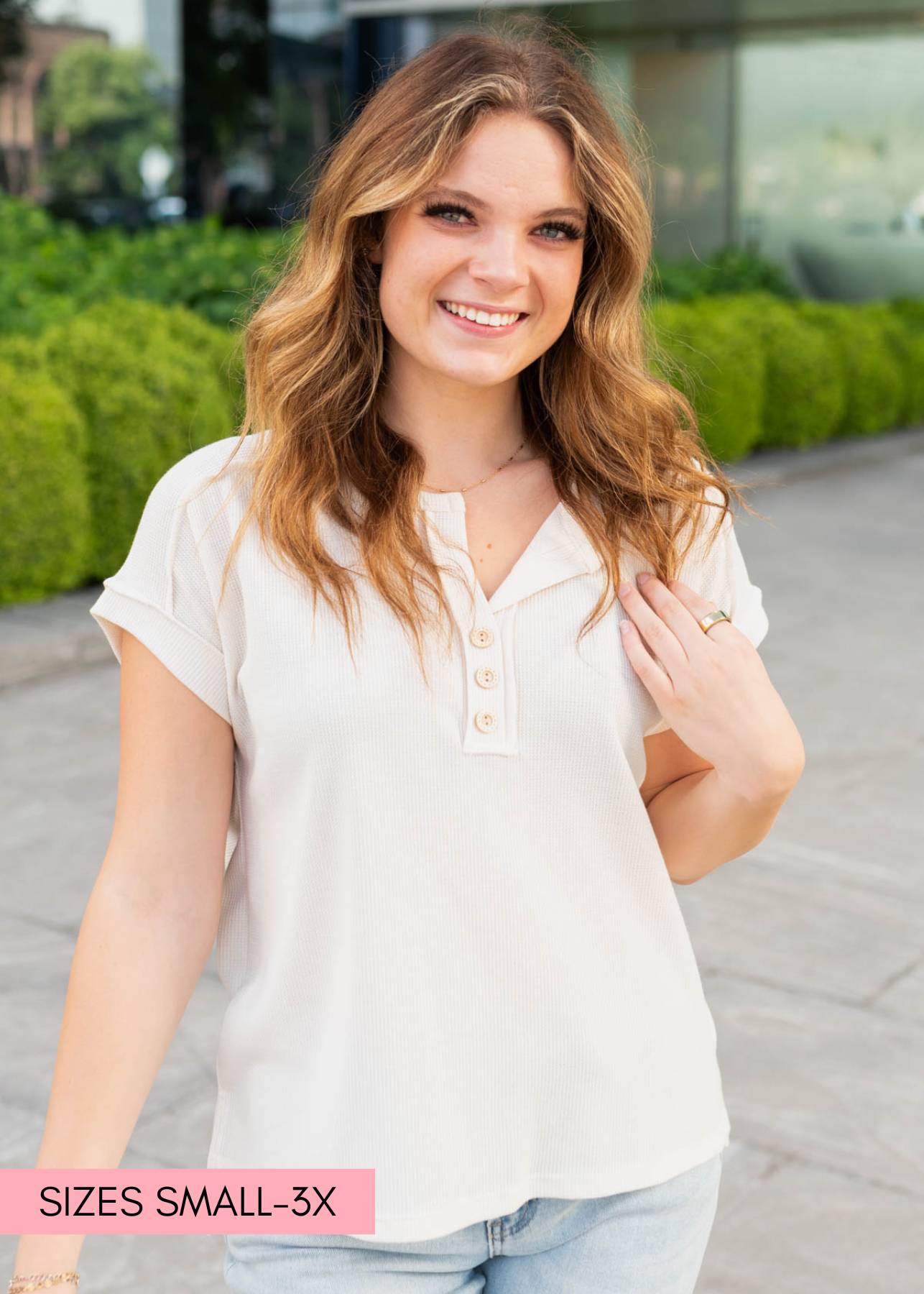 Cream waffle knit top with buttons at the neck