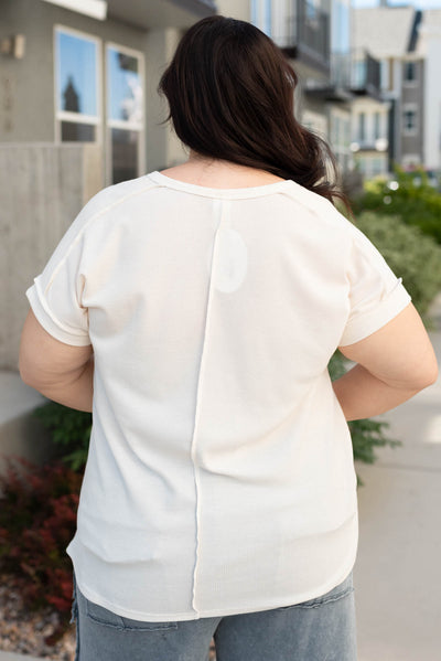 Back view of the plus size cream waffle knit top