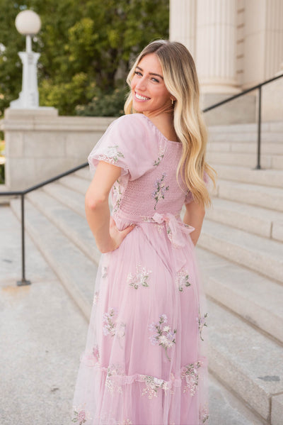 Side view of the dusty pink embroidered dress