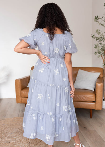 Back view of the dusty blue embrodered dress