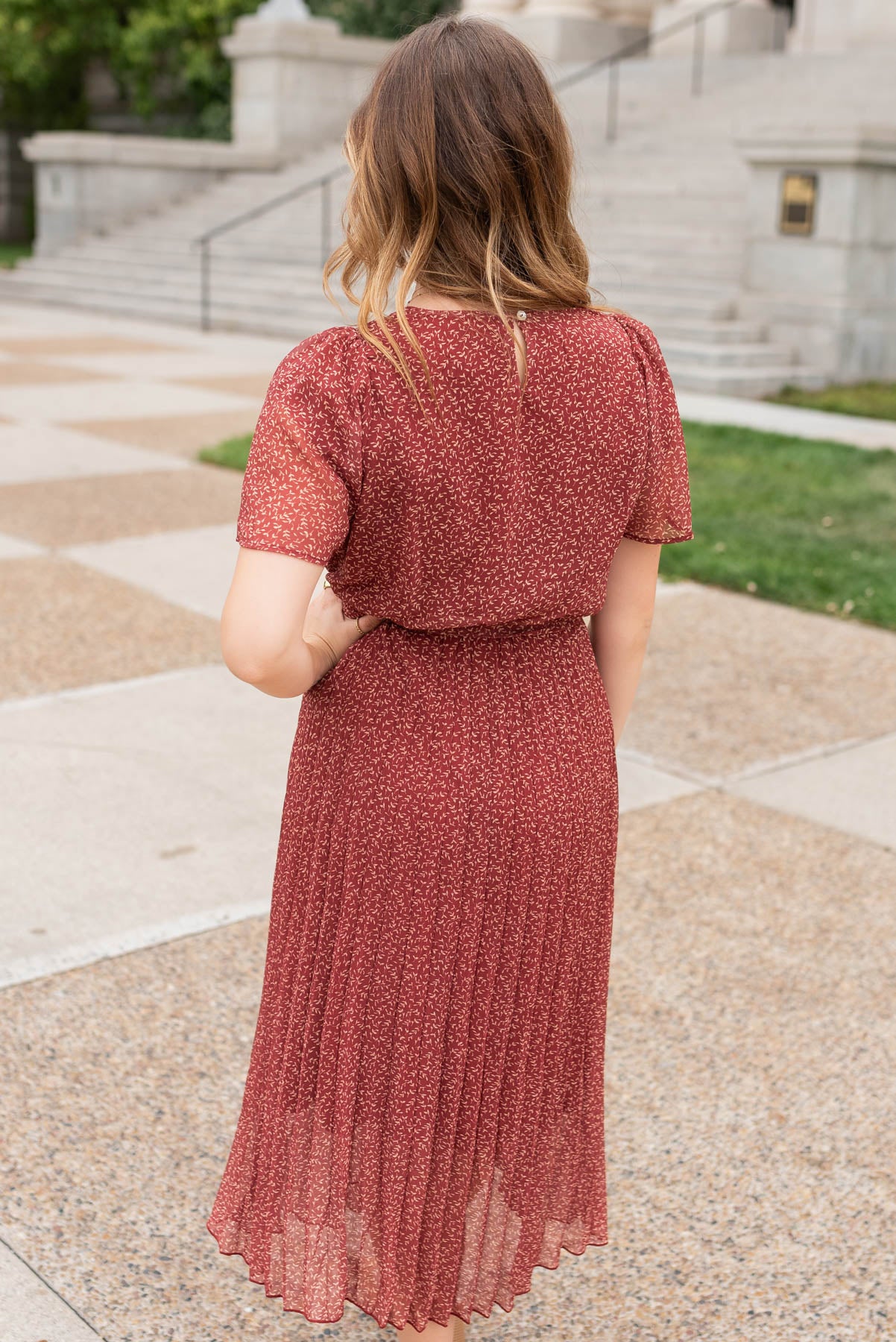 Back view of the b urgundy pleated tie dress