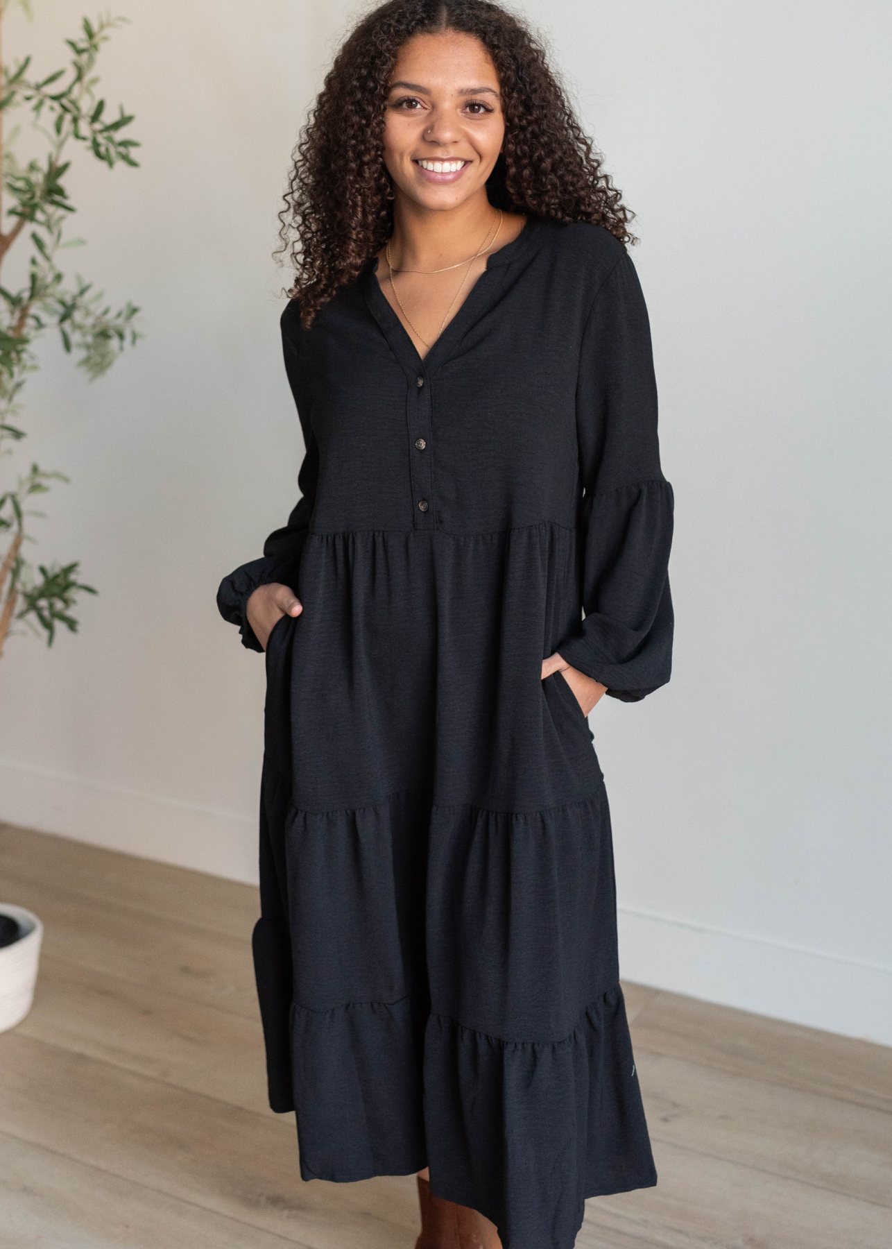 Black tiered dress with long sleeves