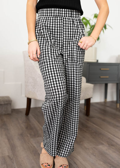 Front view of the black and white gingham pants with front pockets