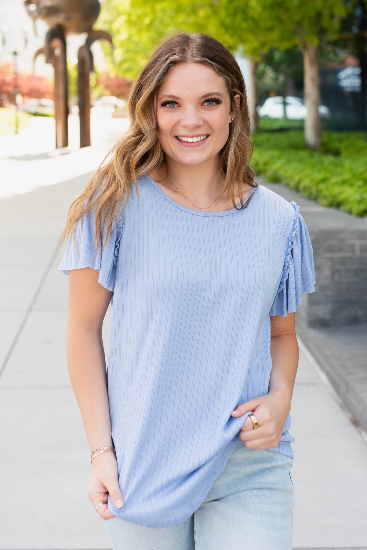 Small light blue textured top