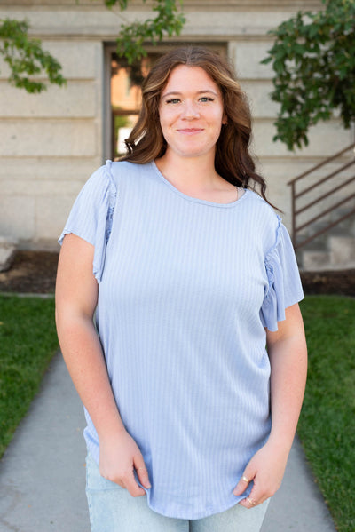 Plus size light blue textured top with short ruffle sleeves