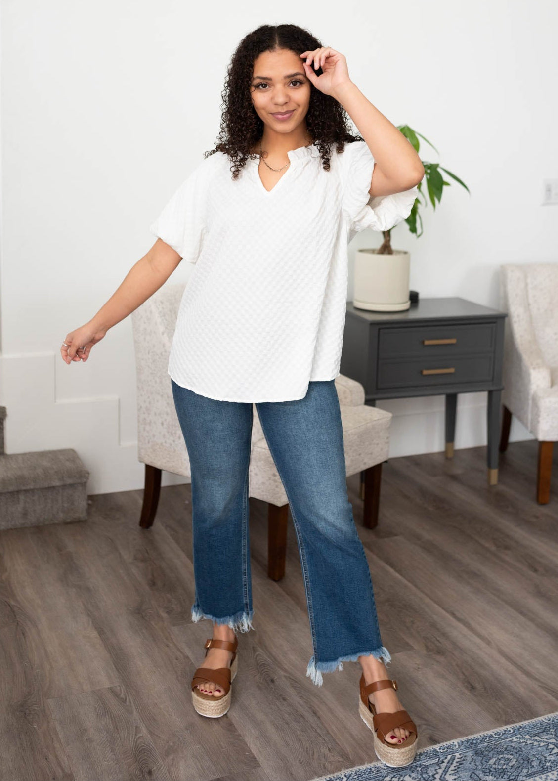 Puff short sleeves on the white textured top