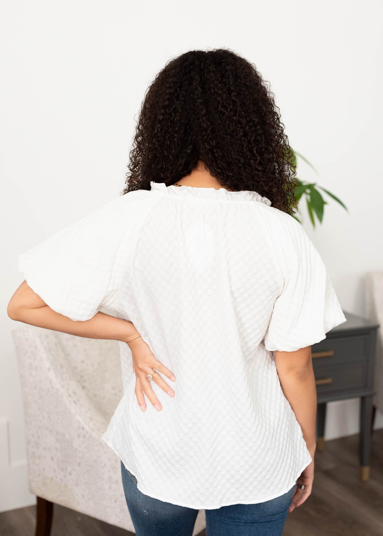 Back view of the white textured top